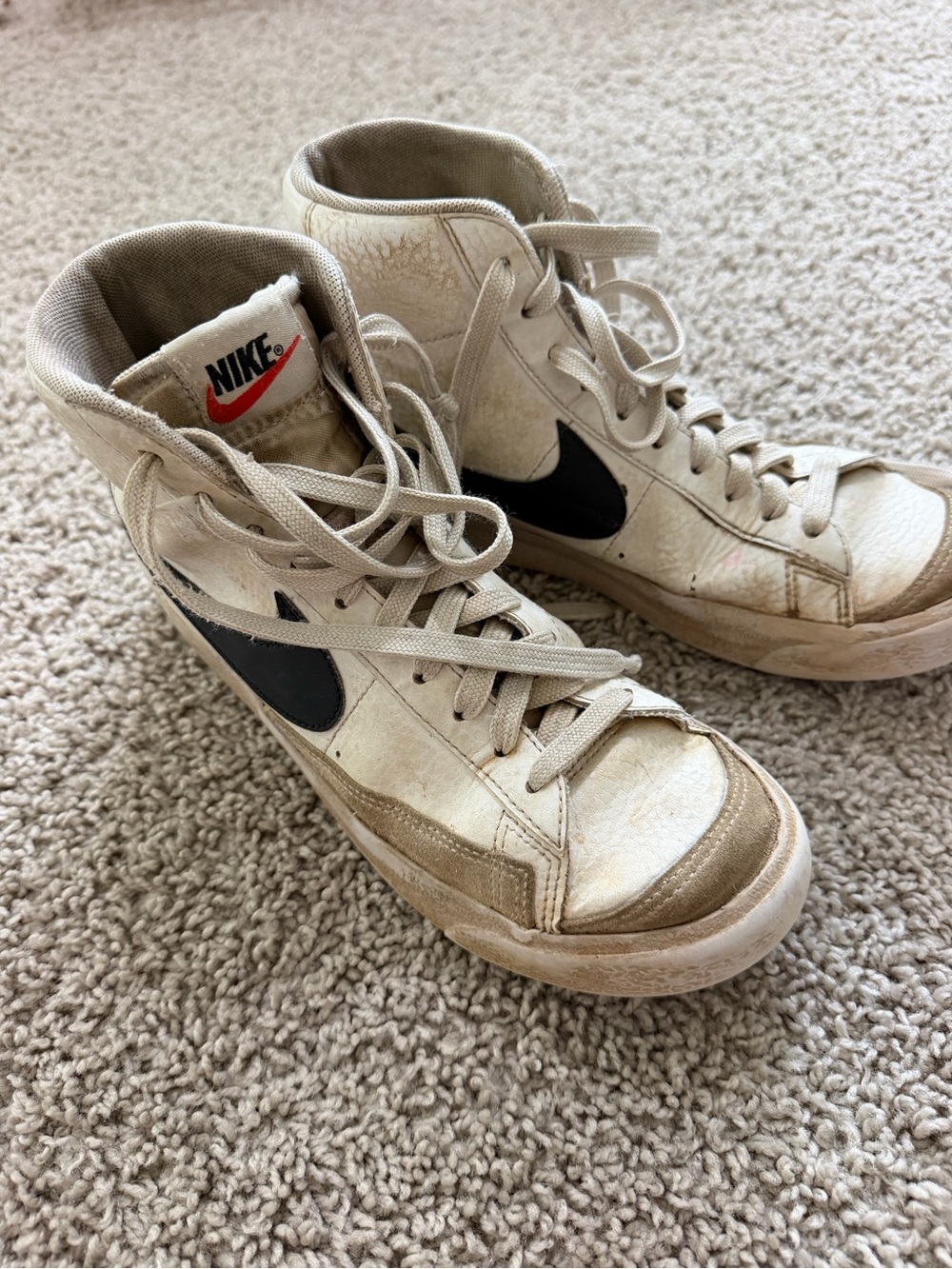 Nike Beige High-Top Sneakers with Black Swoosh